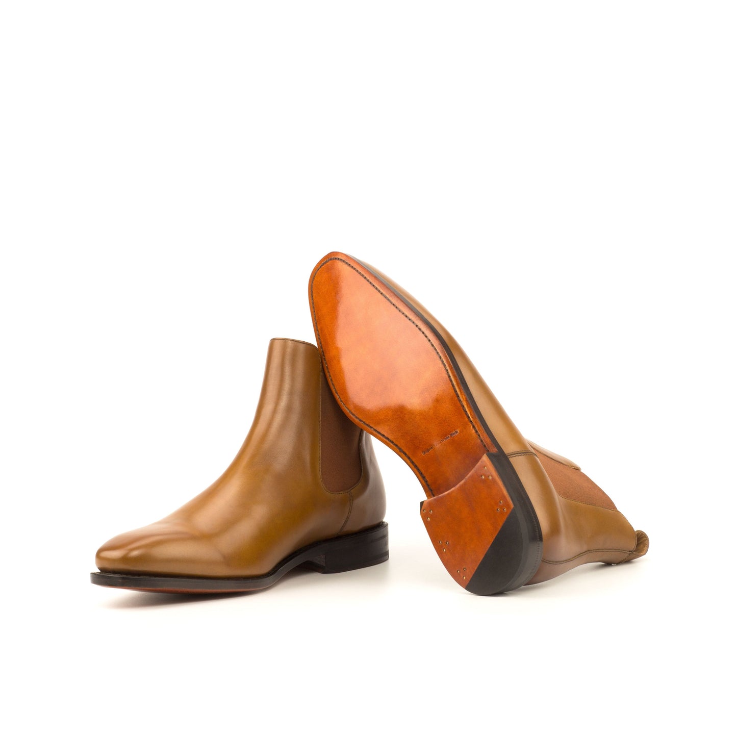 Cognac box calf Chelsea boots showing cognac leather soles