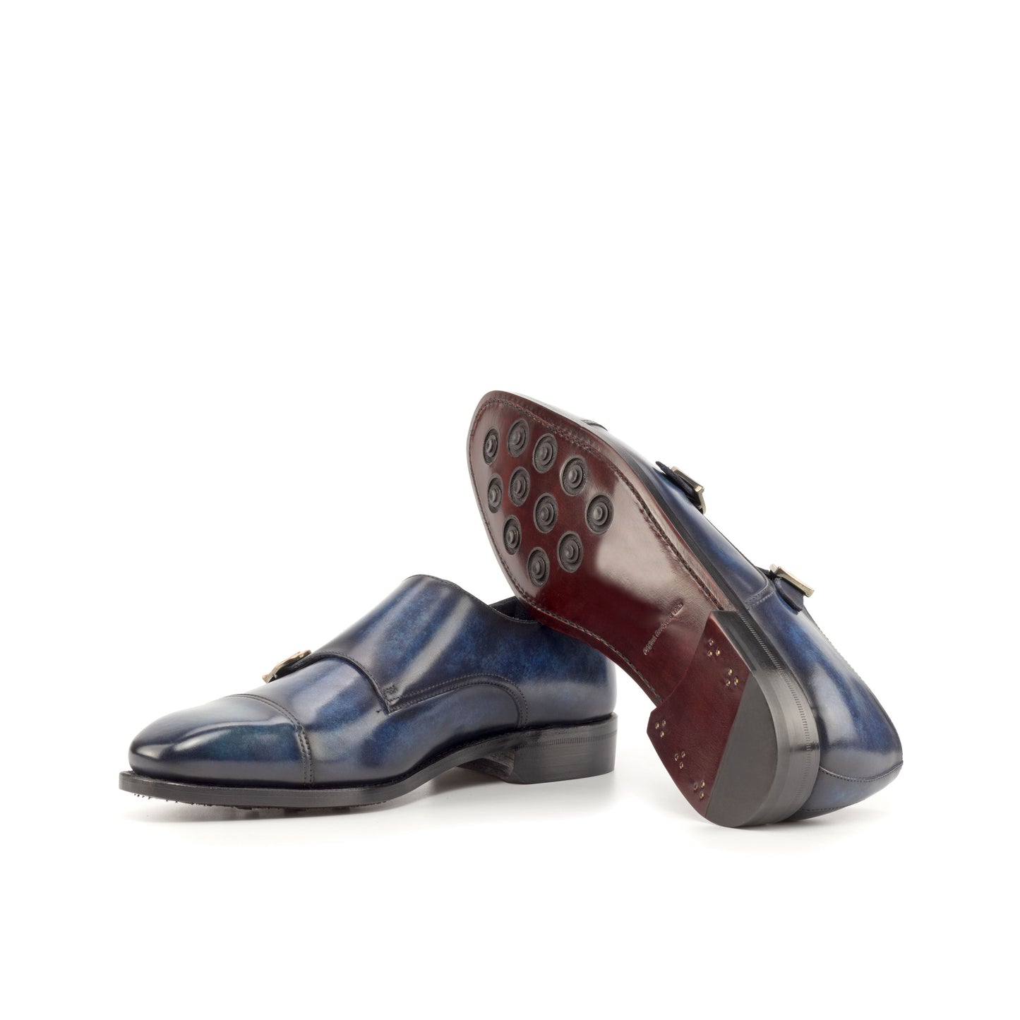 Double Monk Strap in Denim Marble Patina Box Calf showing dark red leather sole with rubber button injections