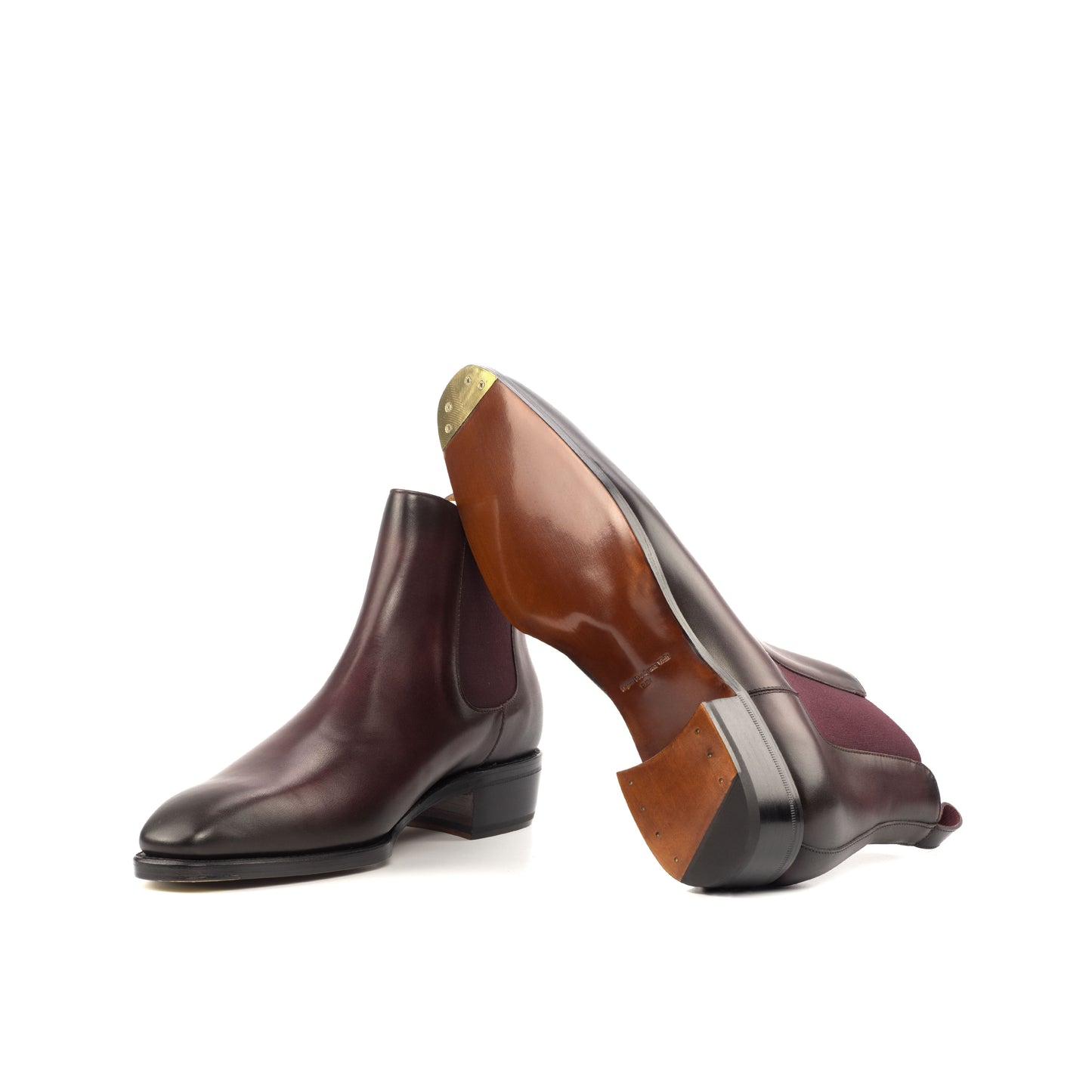 Cognac leather sole and toe plates on burgundy Chelsea boots