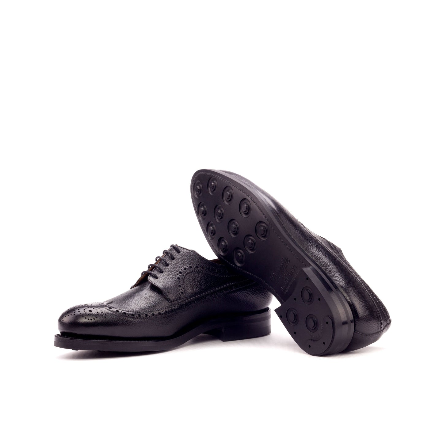 Long Wingtip Derby in Black Painted Full-Grain Box Calf showing black dainite rubber sole
