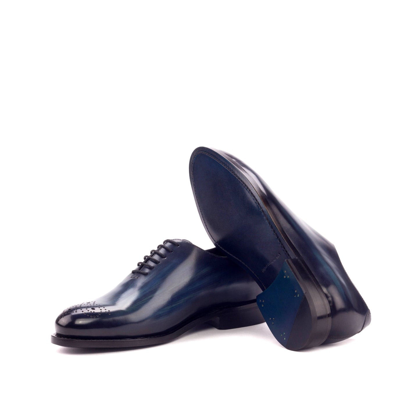 Wholecut Oxford in Denim Patina Box Calf showing turquoise leather sole