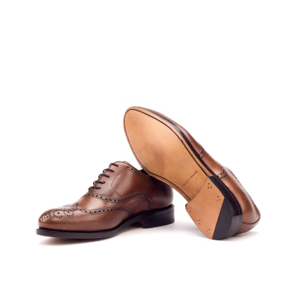 Medium brown painted calf wingtip Oxfords, sole and profile view