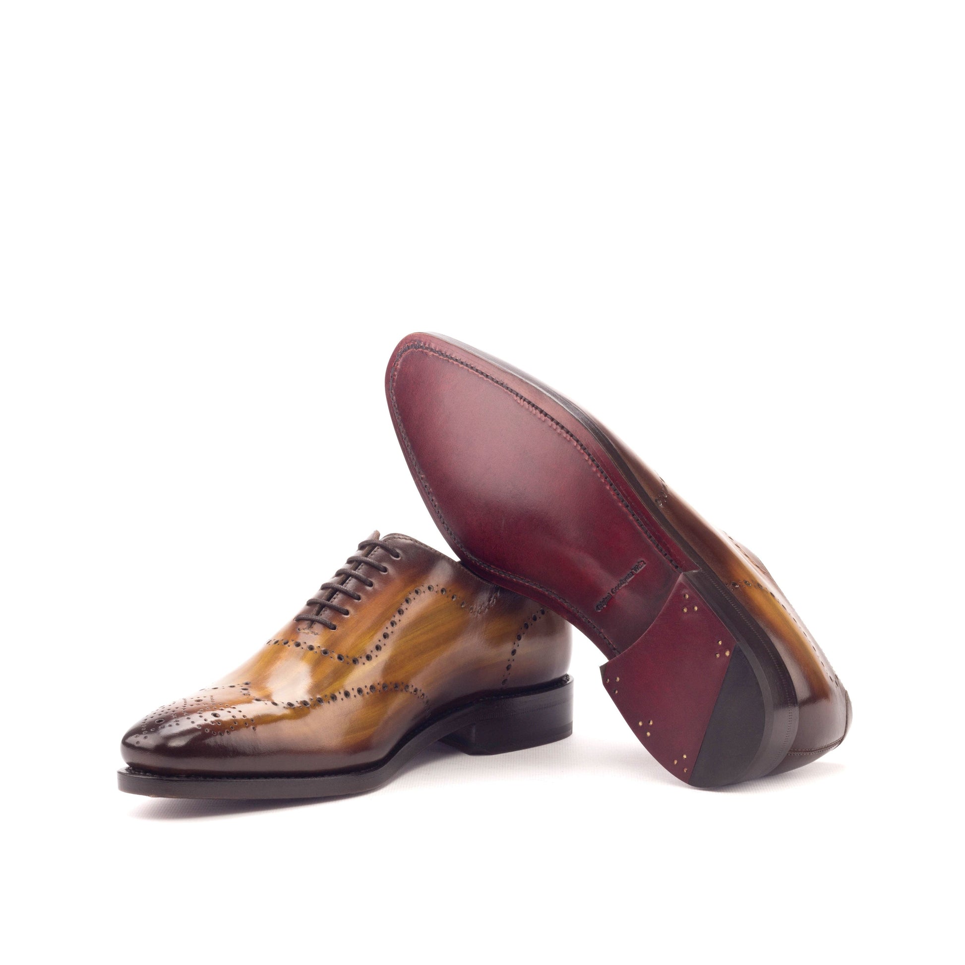 Wholecut Oxford in Cognac Patina Box Calf showing dark red leather sole