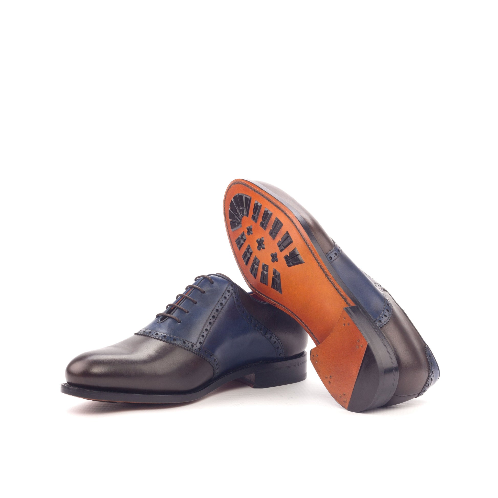 Saddle Shoe in Dark Brown Painted Box Calf and Navy Painted Box Calf showing cognac leather sole with mountain rubber injections