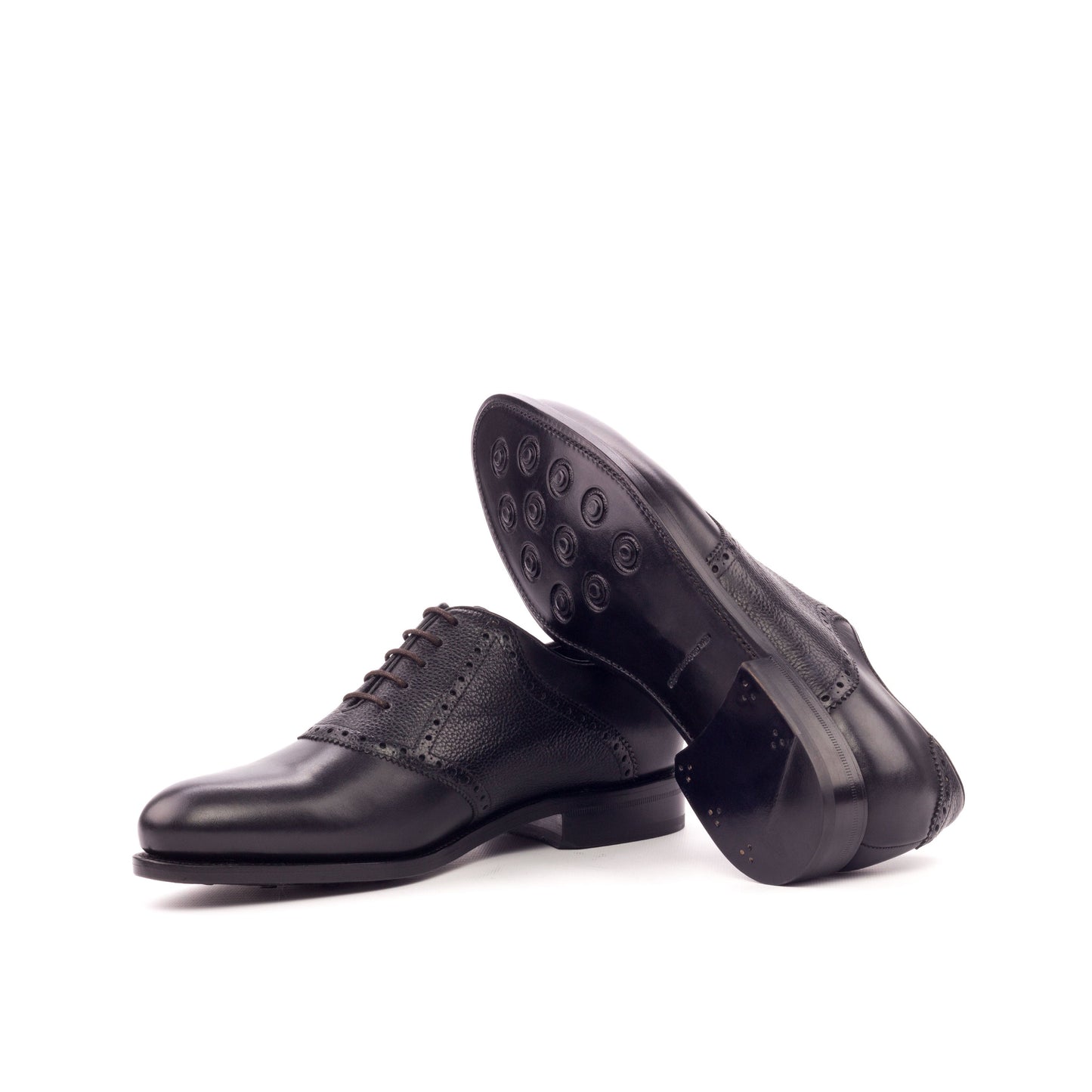 Saddle Shoe in Black Painted Box Calf and Black Painted Full-Grain Box Calf showing black leather sole with rubber button injections