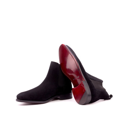 Black Lux Suede Chelsea boots showing dark red leather soles