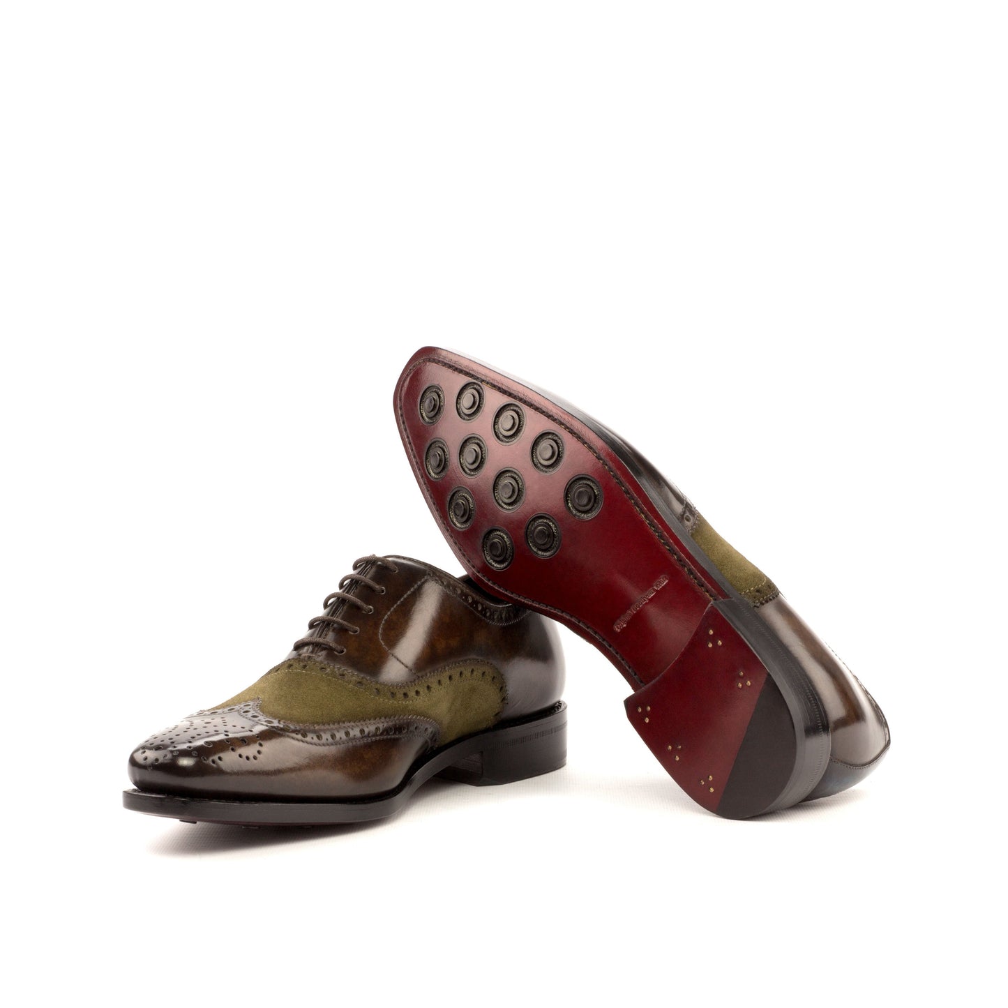 Wingtip Oxford in Brown Marble Patina Box Calf and Khaki Lux Suede showing dark red leather sole with rubber button injections