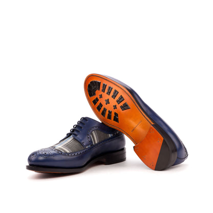 Long Wingtip Derby in Navy Painted Box Calf and Grey and Blue Wool Plaid showing cognac leather sole with mountain rubber injections