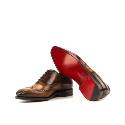 Wingtip Oxford in Cognac Marble Patina Box Calf and Brown Marble Patina Box Calf showing red leather sole