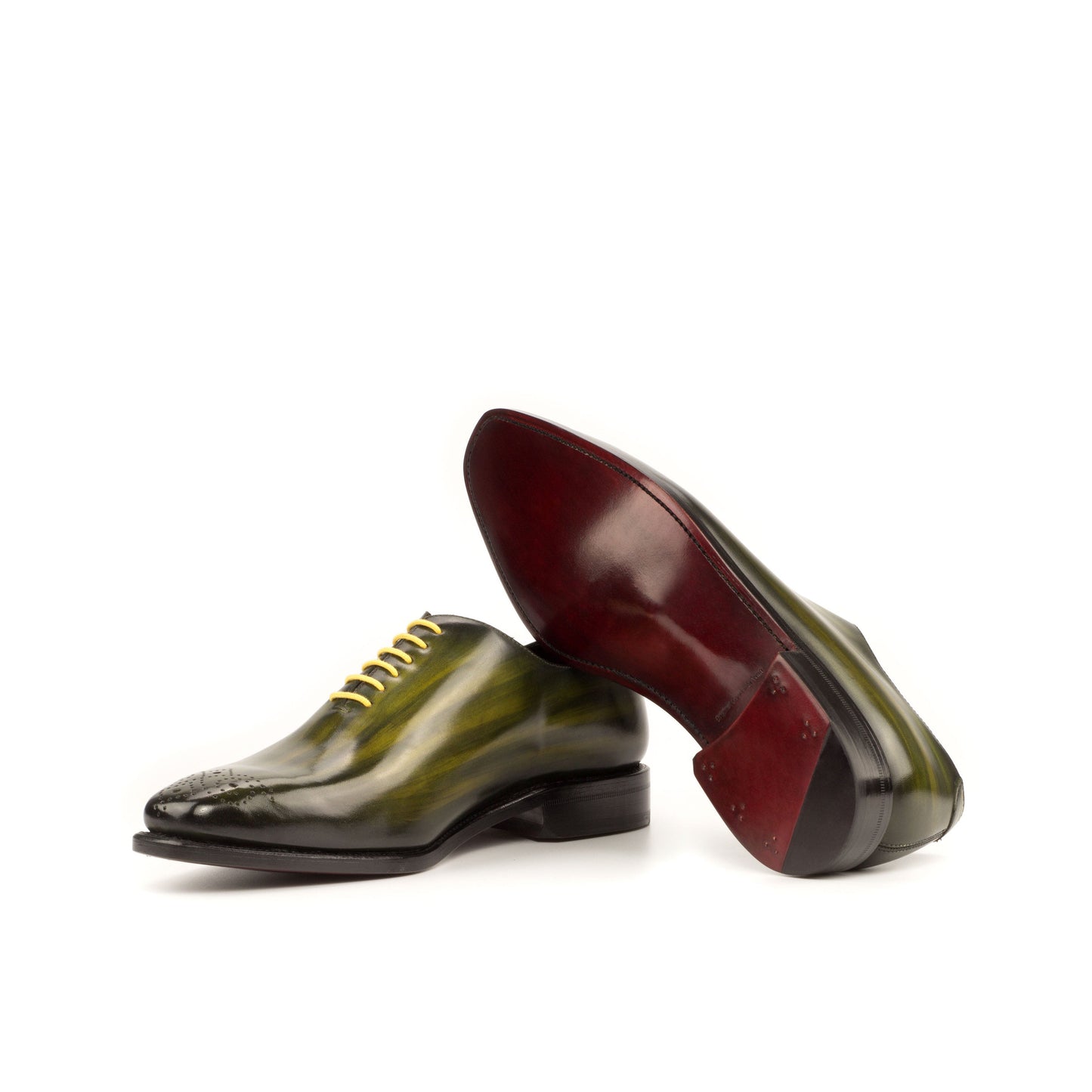 Wholecut Oxford in Khaki Patina Box Calf showing dark red leather sole