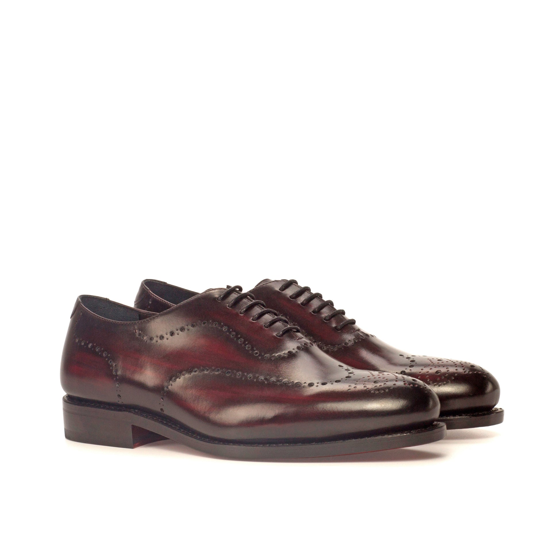 Wholecut Oxford in Burgundy Patina Box Calf and Black Box Calf, front three-quarter view
