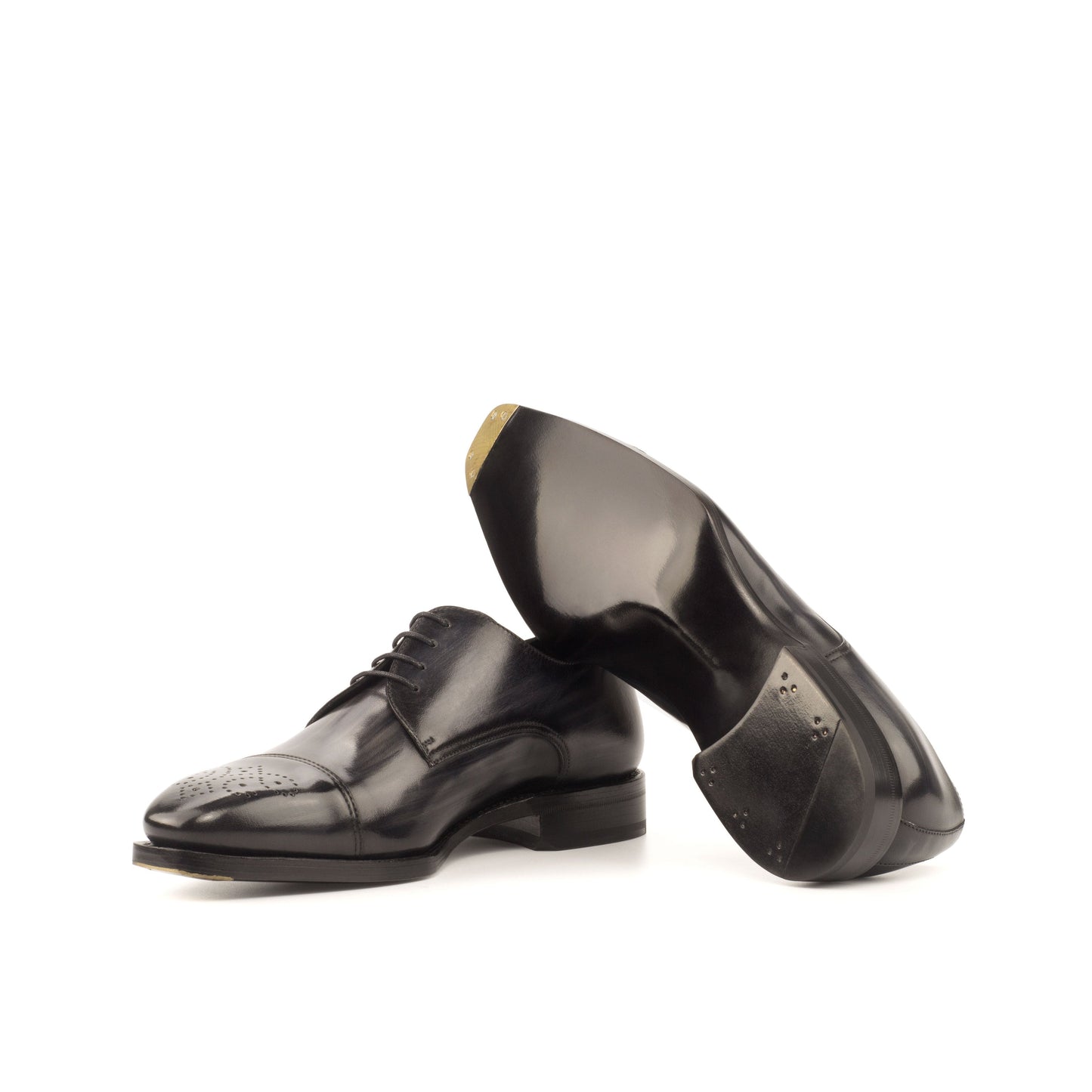 Derby in Grey Patina Box Calf showing black leather sole with a bevelled waist