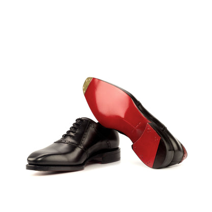 Saddle Shoe in Black Box Calf and Red Painted Box Calf showing red leather sole with a bevelled waist