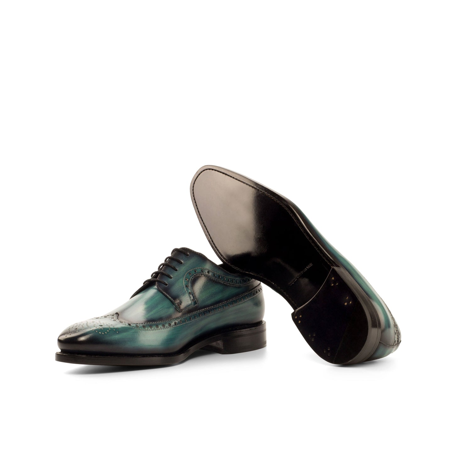 Long Wingtip Derby in Turquoise Patina Box Calf showing black leather sole