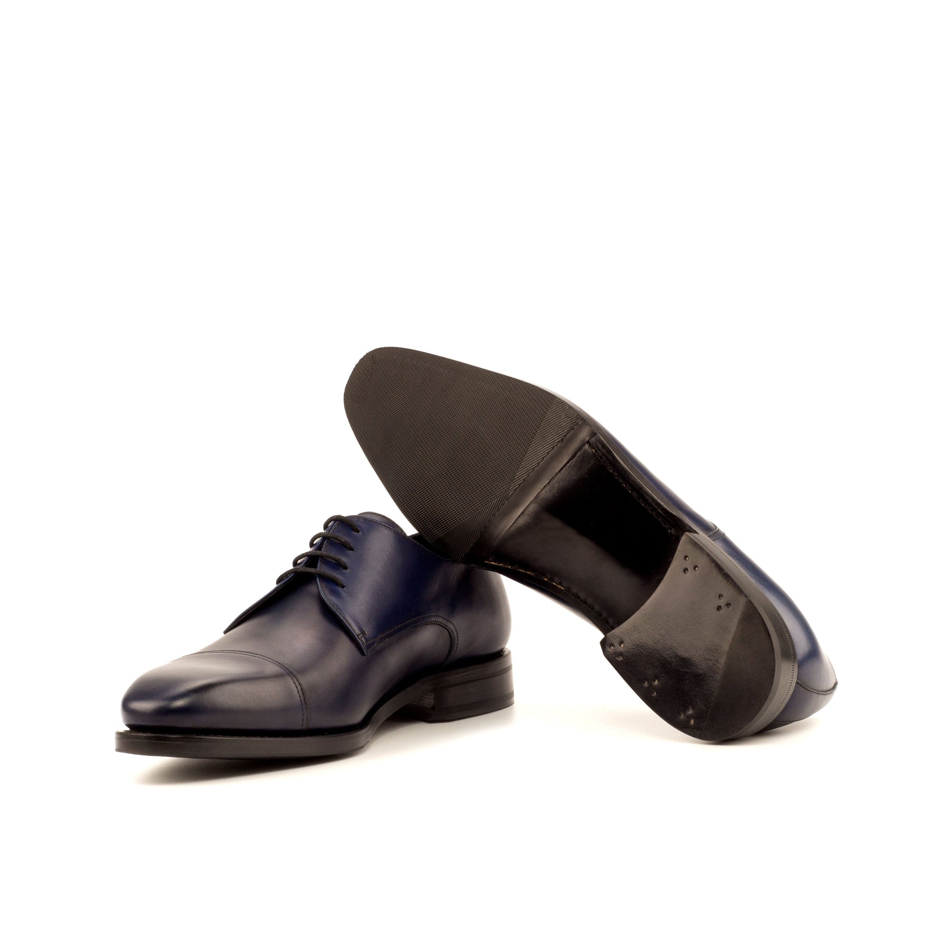 Derby in Navy Painted Box Calf showing black leather and rubber combination sole