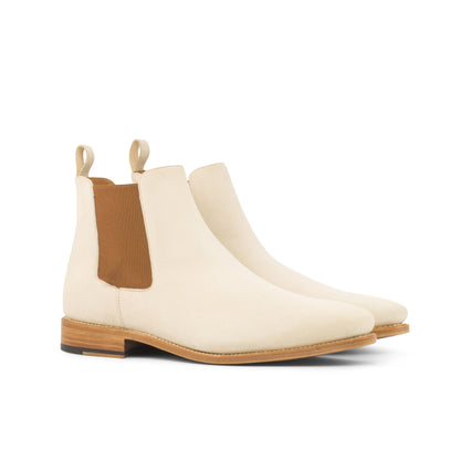 Pair of ivory kid suede Chelsea boots with cognac elastic gussets, front three-quarter view