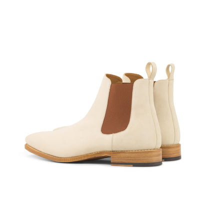 Ivory kid suede Chelsea boots with cognac elastic gussets, rear three-quarter view