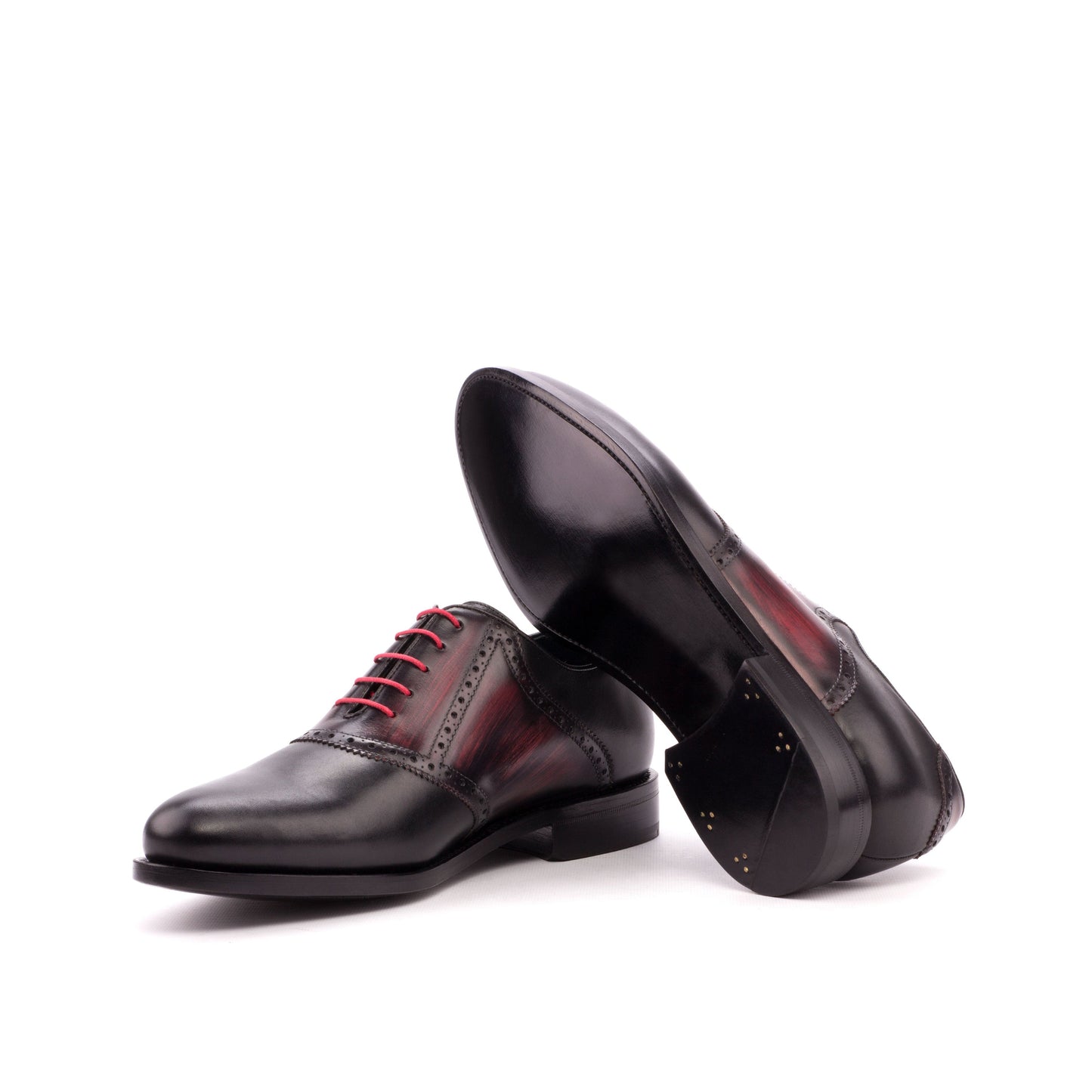 Saddle Shoe in Black Box Calf and Burgundy Patina Box Calf showing dark red leather sole