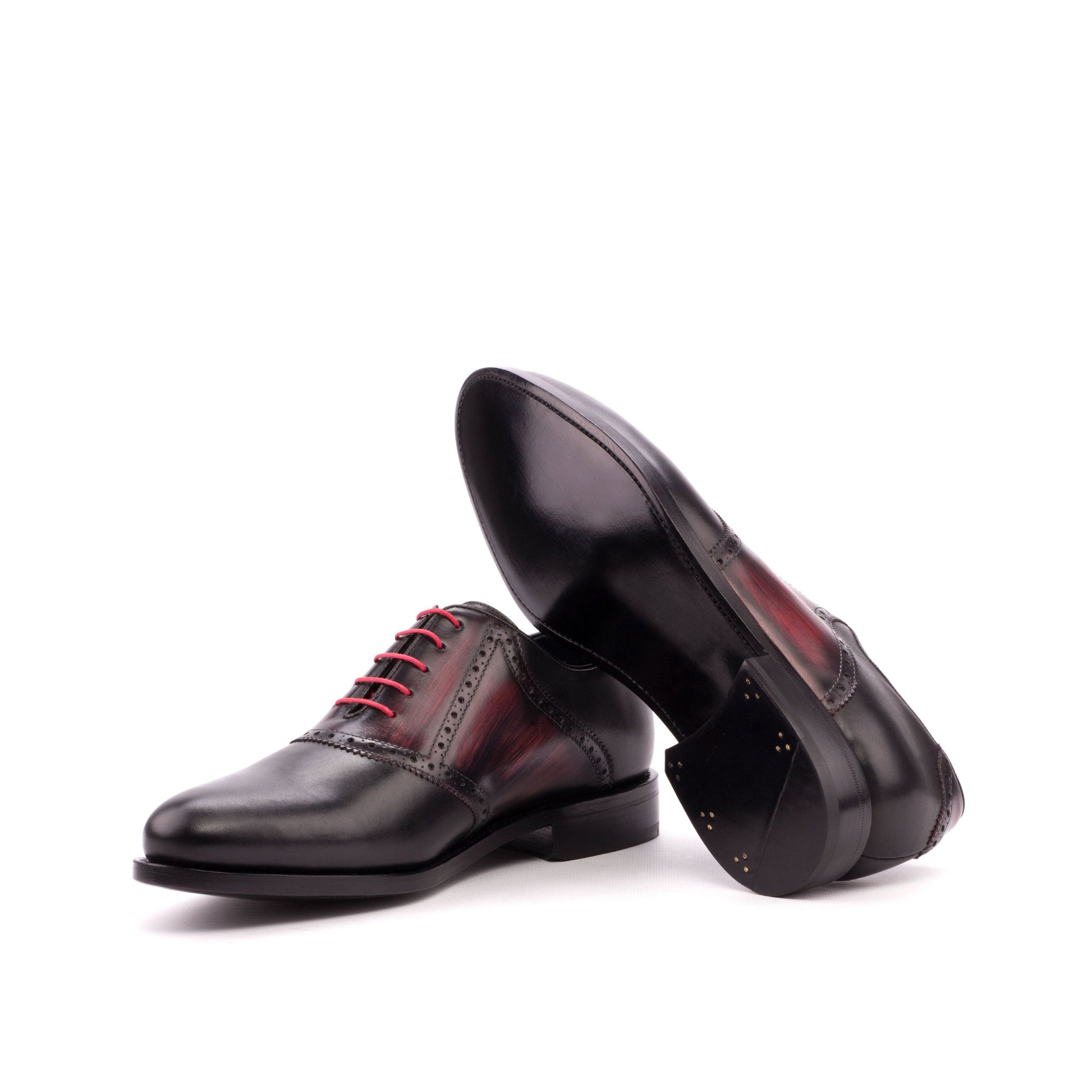 Saddle Shoe in Black Box Calf and Burgundy Patina Box Calf showing dark red leather sole