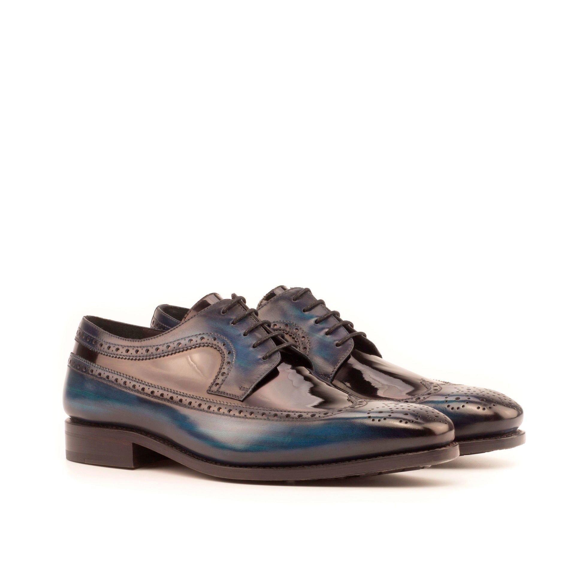 Long Wingtip Derby in Denim Patina Box Calf and Black Patent Leather, front three-quarter view