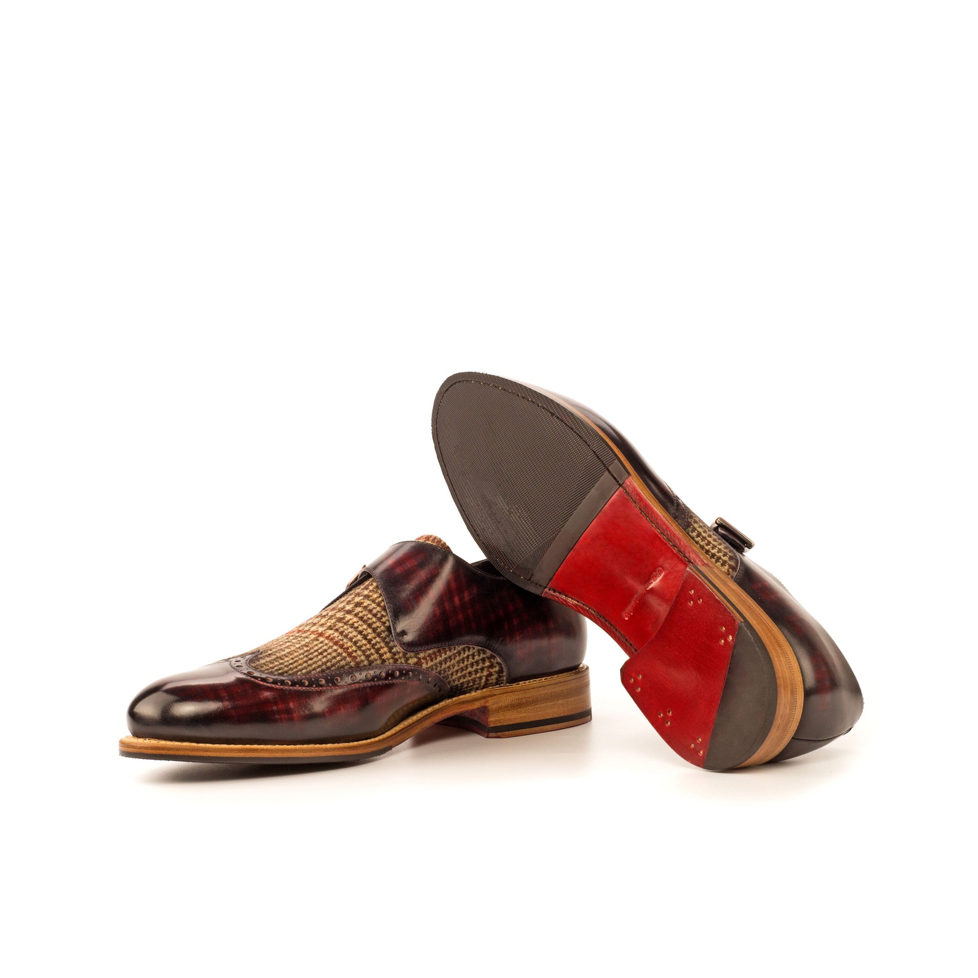 Single Monk Strap in Burgundy Patina Box Calf and Black Herringbone Fabric showing red leather and rubber combination sole