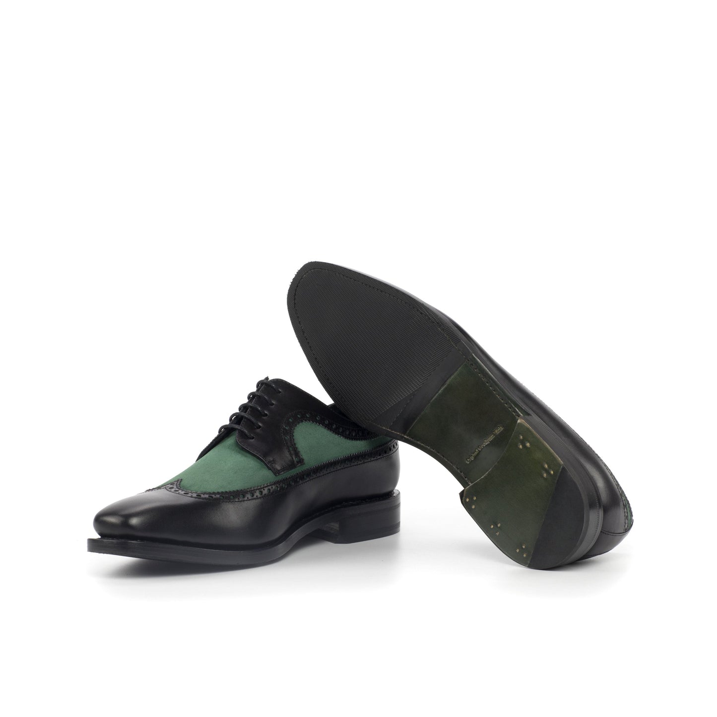 Long Wingtip Derby in Black Painted Box Calf and Forest Green Kid Suede showing forest green leather and rubber combination sole