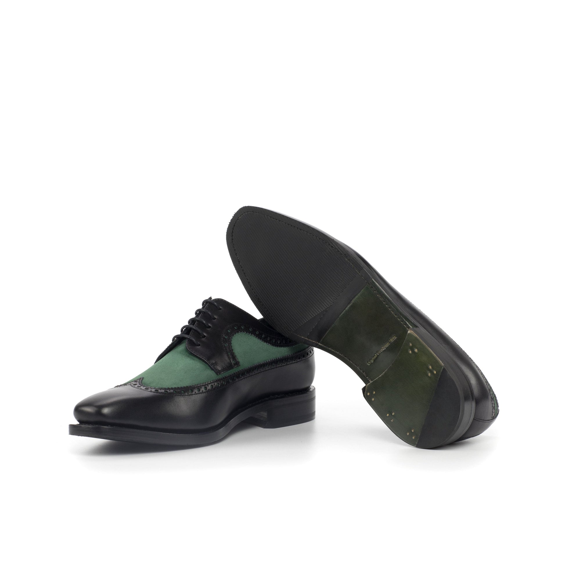 Long Wingtip Derby in Black Painted Box Calf and Forest Green Kid Suede showing forest green leather and rubber combination sole