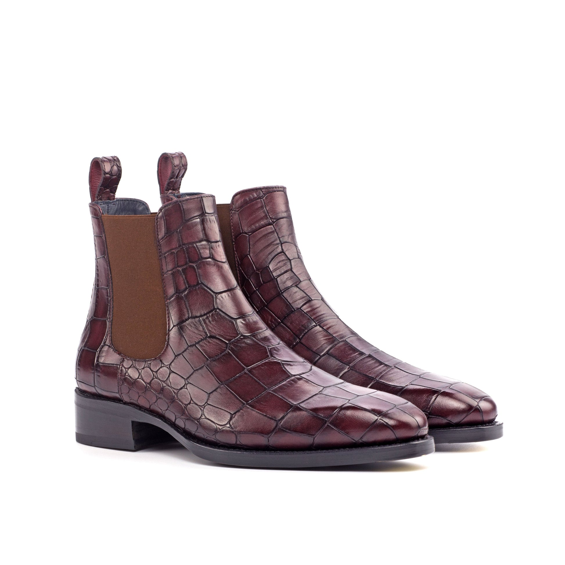 Pair of burgundy painted croco-embossed box calf Chelsea boots, front three-quarter view