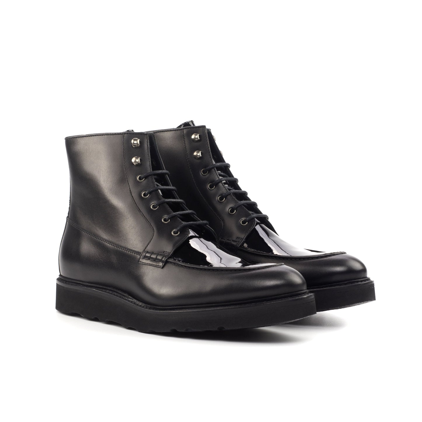 Moc Toe Boot in Black Box Calf and Black Patent Leather, front three-quarter view