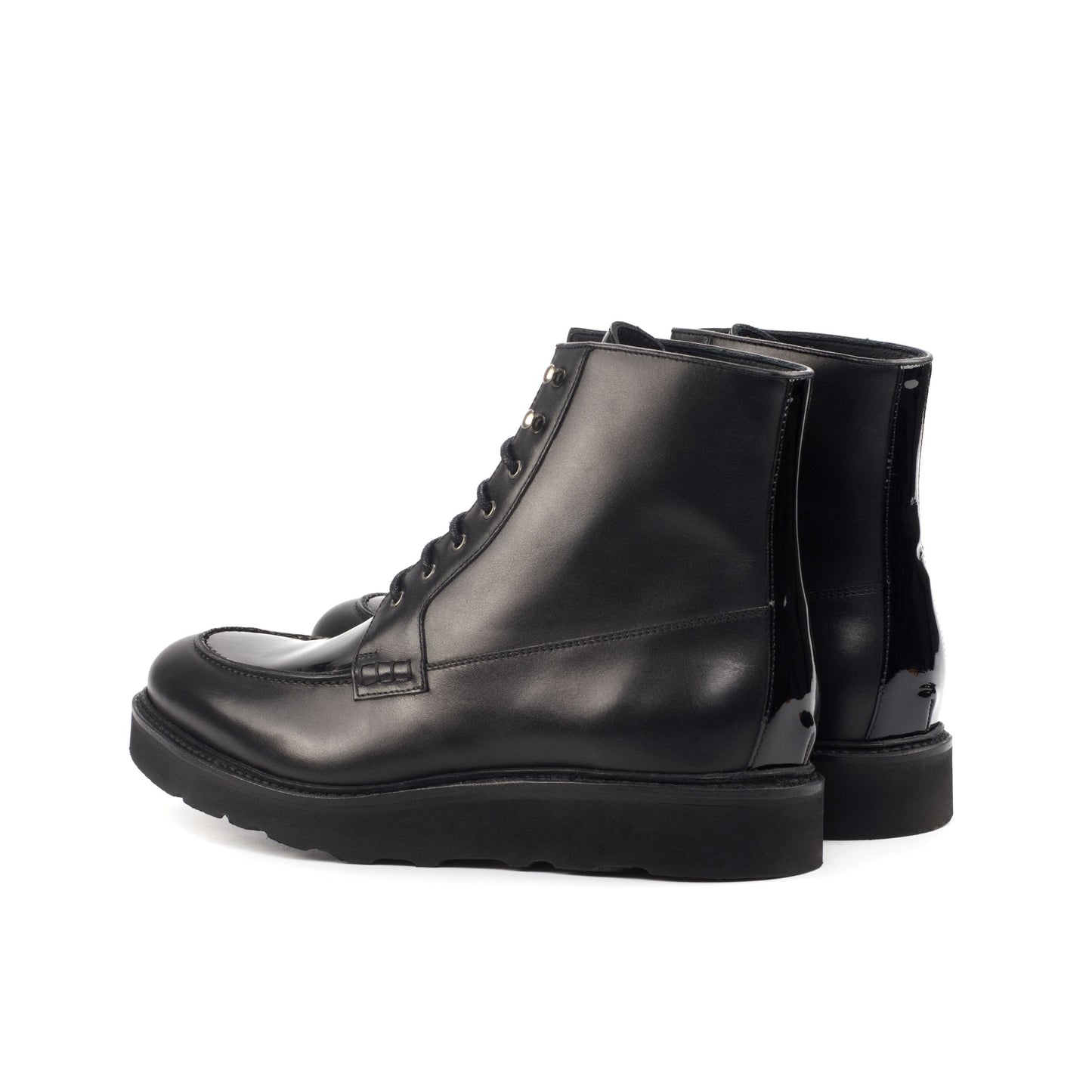 Moc Toe Boot in Black Box Calf and Black Patent Leather, rear three-quarter view
