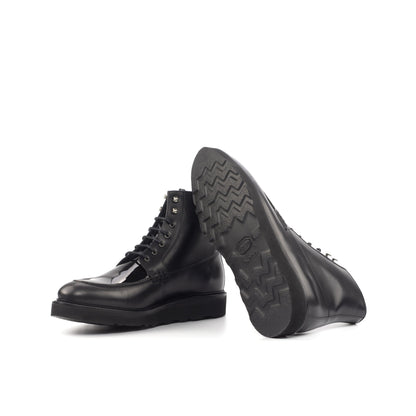 Moc Toe Boot in Black Box Calf and Black Patent Leather showing black vibram rubber sole