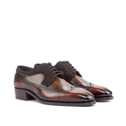 Long Wingtip Derby in Fire Museum Patina Box Calf and Brown Patina Box Calf, front three-quarter view