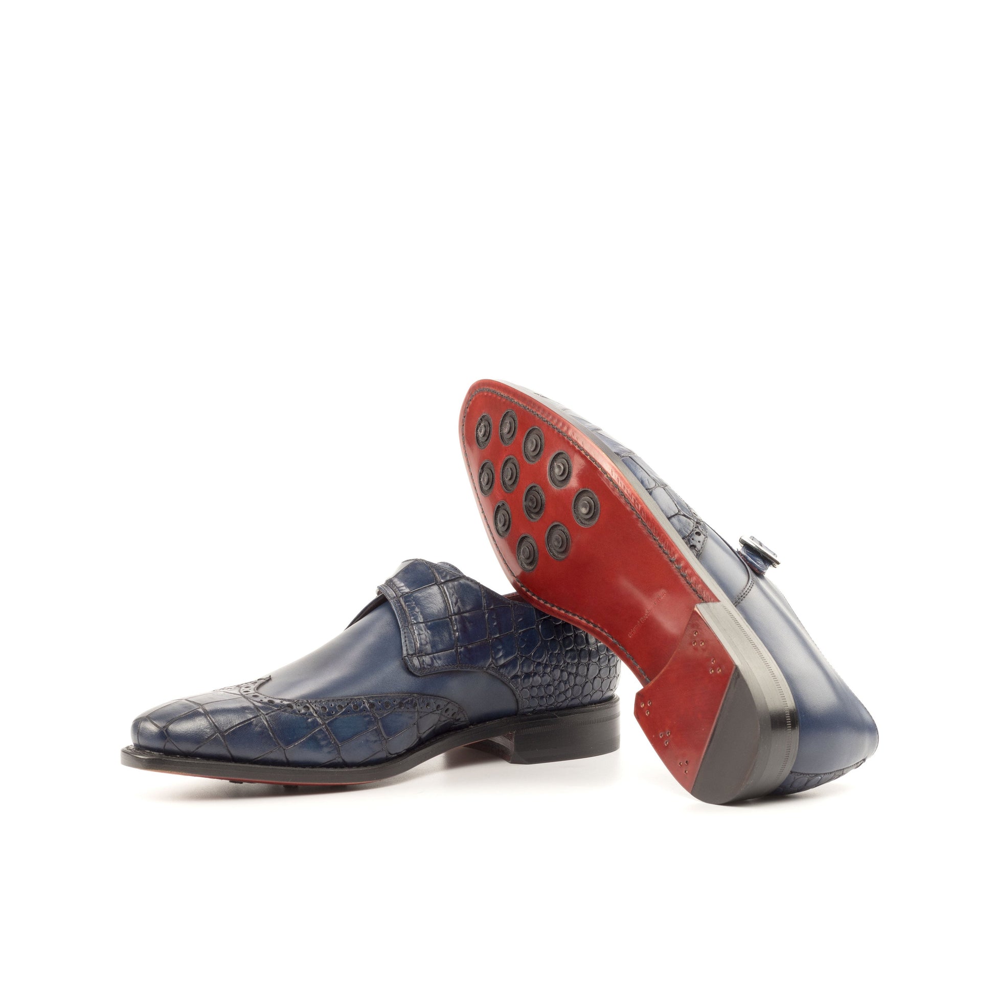 Single Monk Strap in Navy Painted Croco-Embossed Box Calf and Black Herringbone Fabric showing red leather sole with rubber button injections