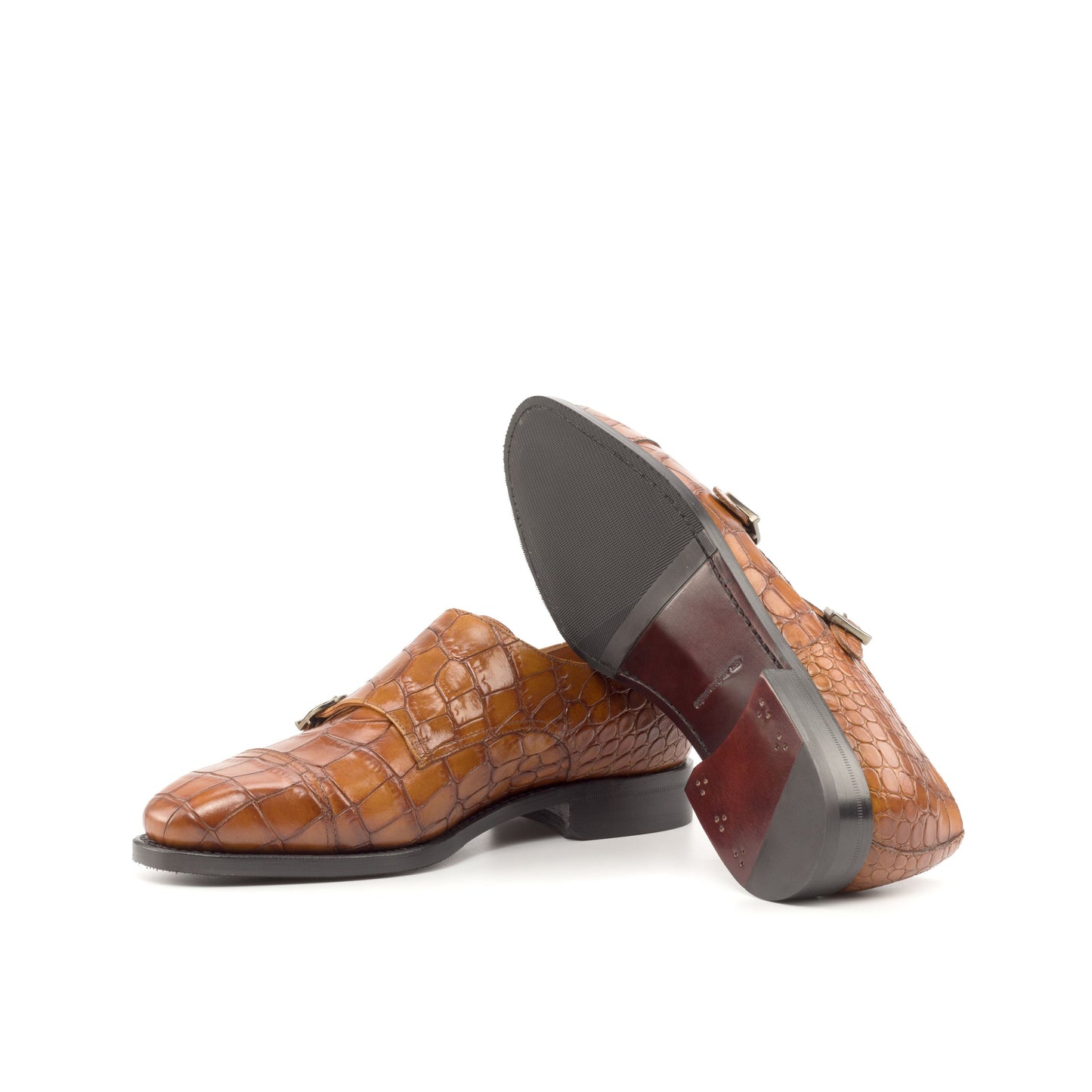 Double Monk Strap in Cognac Painted Croco-Embossed Box Calf showing dark red leather and rubber combination sole