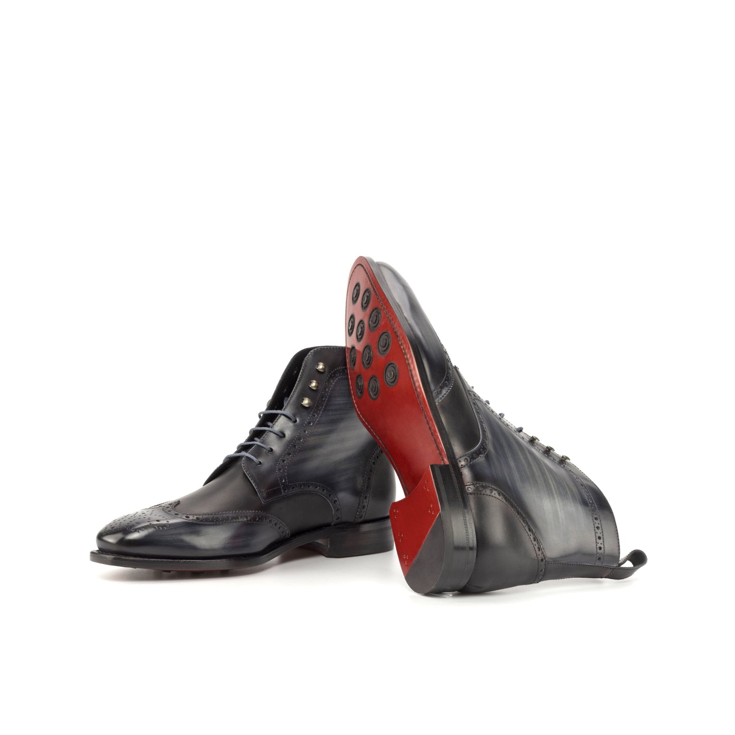 Wingtip Boot in Grey Patina Box Calf and Black Box Calf showing red leather sole with rubber button injections