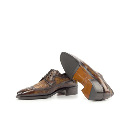 Long Wingtip Derby in Fire Museum Patina Box Calf and Medium Brown Painted Croco-Embossed Box Calf showing cognac leather and rubber combination sole