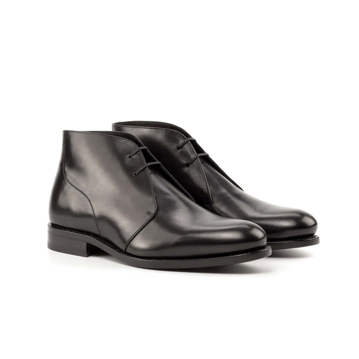 Pair of black box calf Chukka boots, front three-quarter view