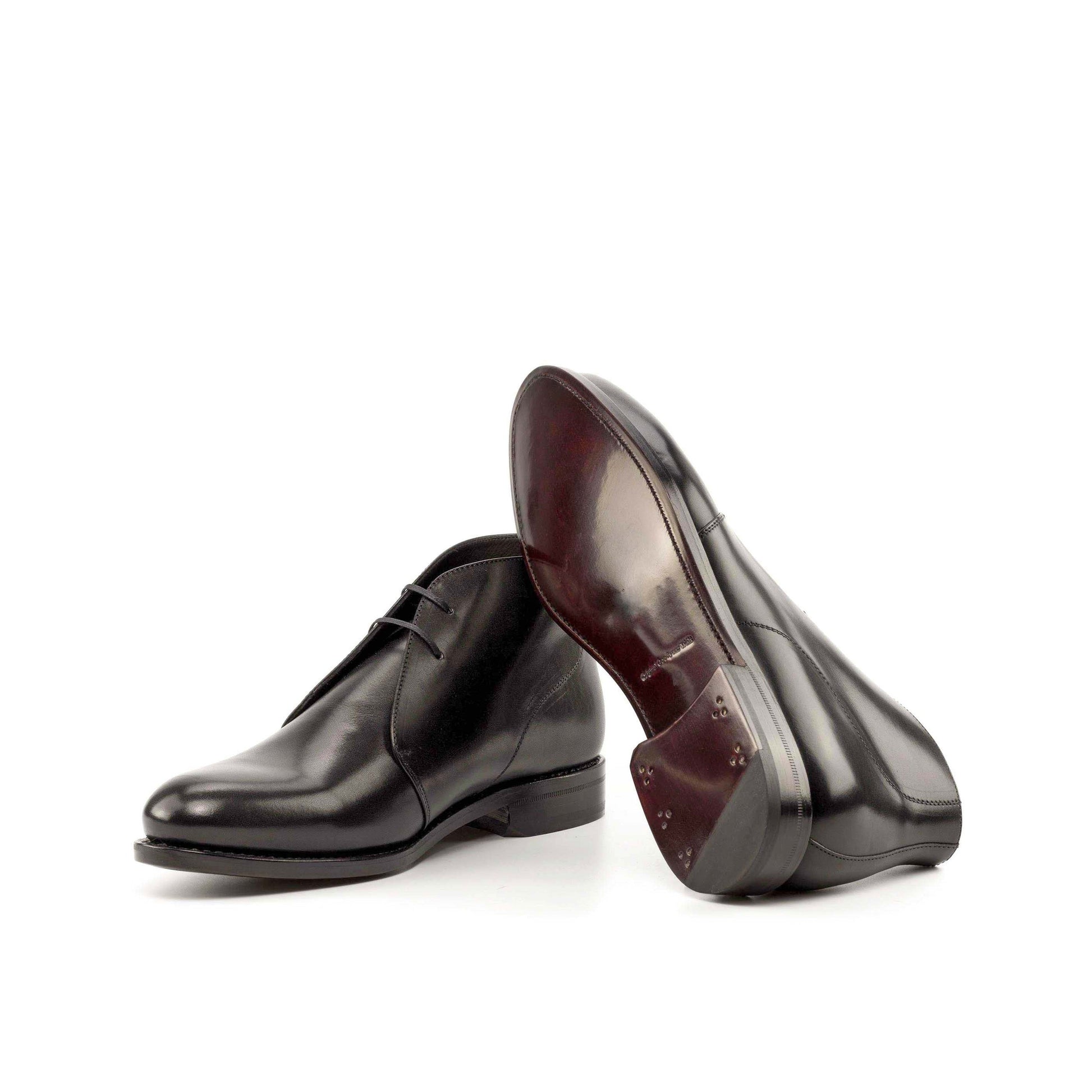 Black Box Calf Chukka boots showing dark red leather sole