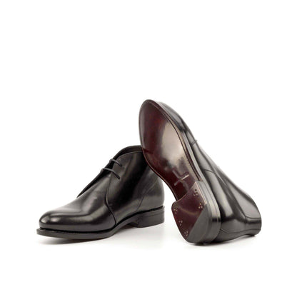 Black Box Calf Chukka boots showing dark red leather sole
