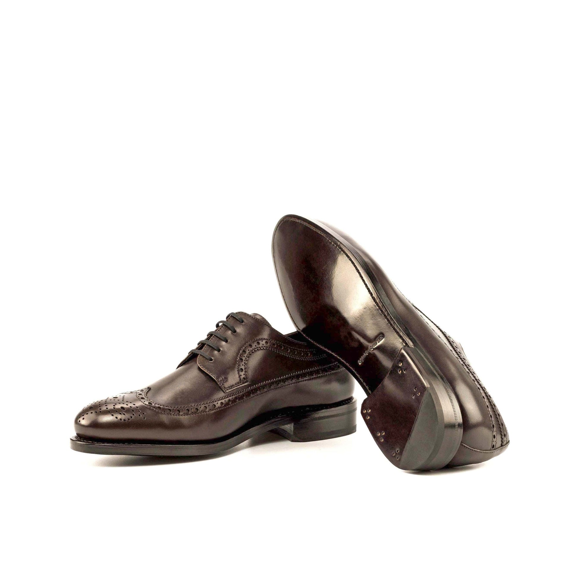 Long Wingtip Derby in Dark Brown Box Calf showing brown leather sole