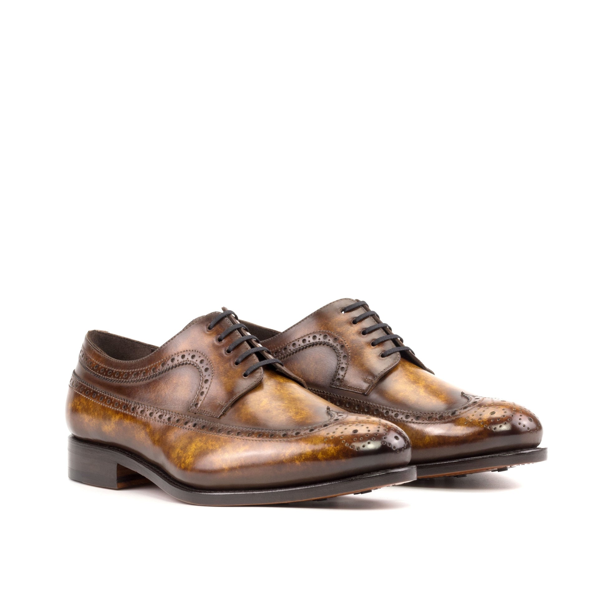 Long Wingtip Derby in Cognac Marble Patina Box Calf, front three-quarter view