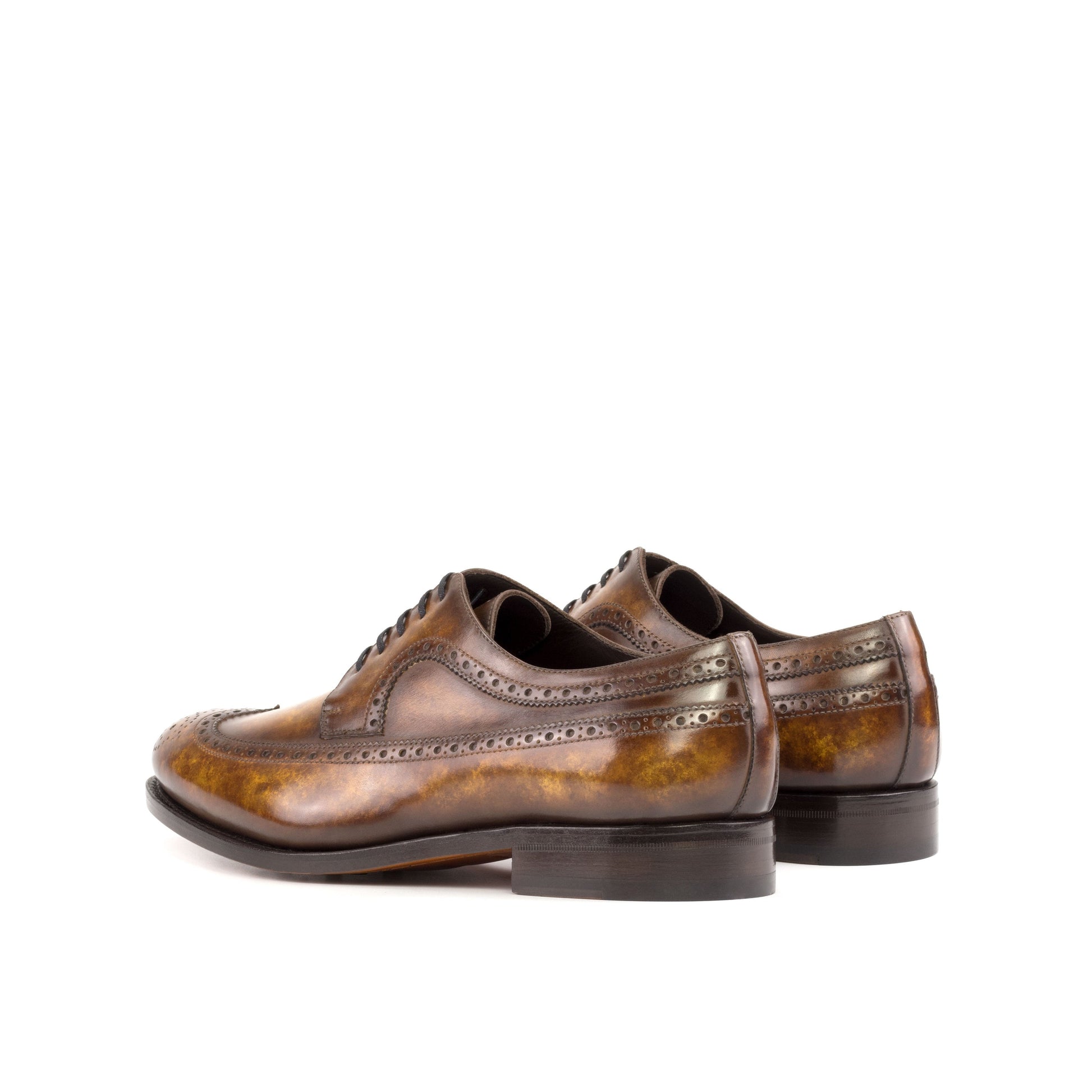 Long Wingtip Derby in Cognac Marble Patina Box Calf, rear three-quarter view