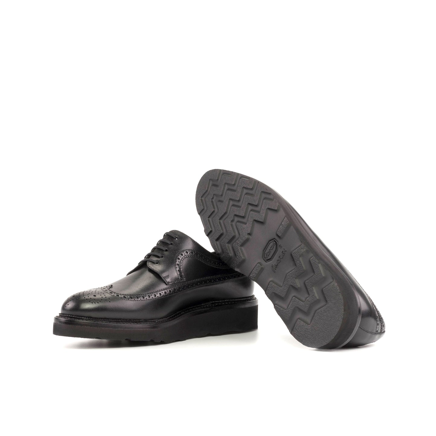 Long Wingtip Derby in Black Box Calf showing black vibram rubber sole