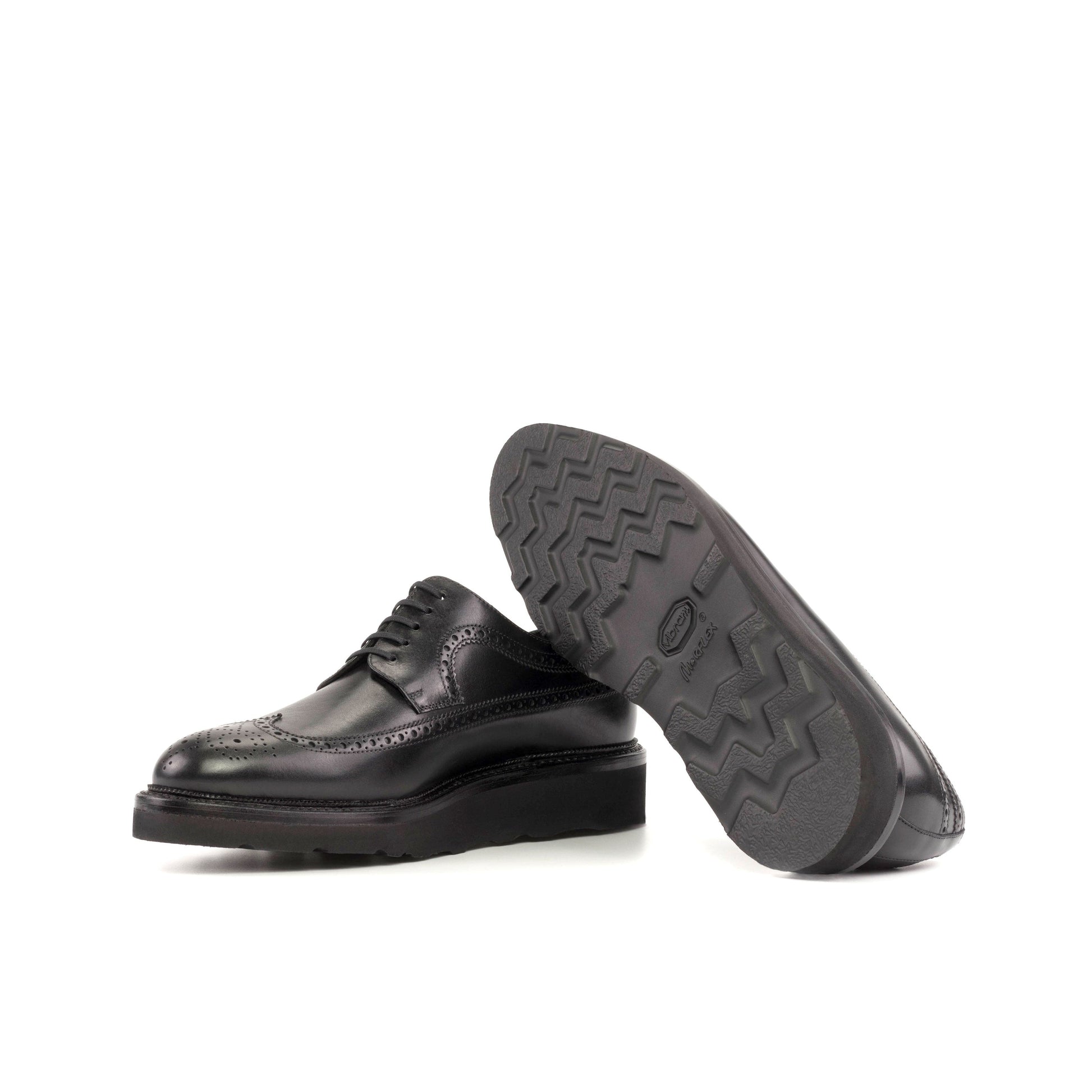 Long Wingtip Derby in Black Box Calf showing black vibram rubber sole