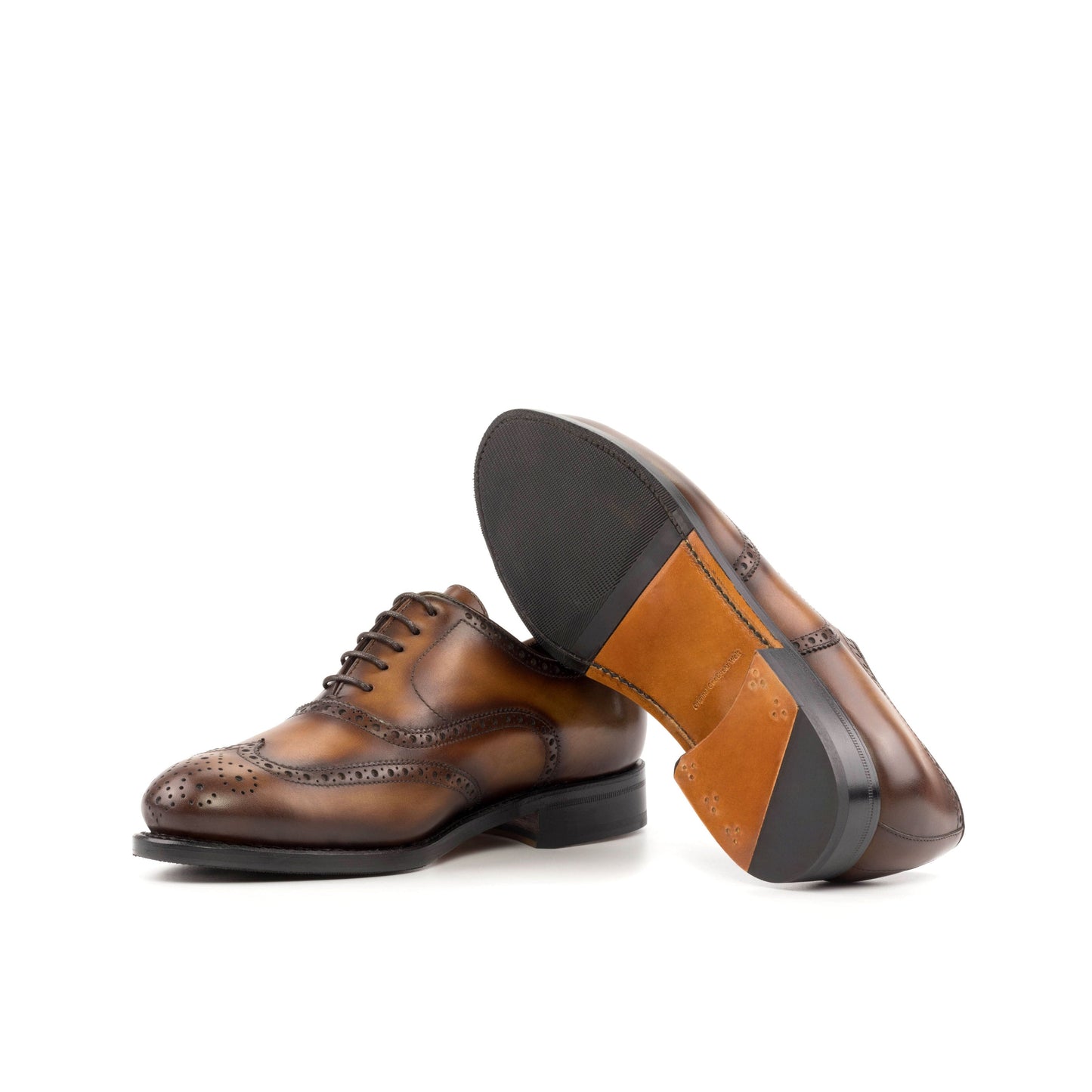 Wingtip Oxford in Medium Brown Painted Box Calf showing cognac leather and rubber combination sole
