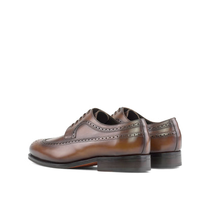 Long Wingtip Derby in Burnished Dark Brown Box Calf, rear three-quarter view