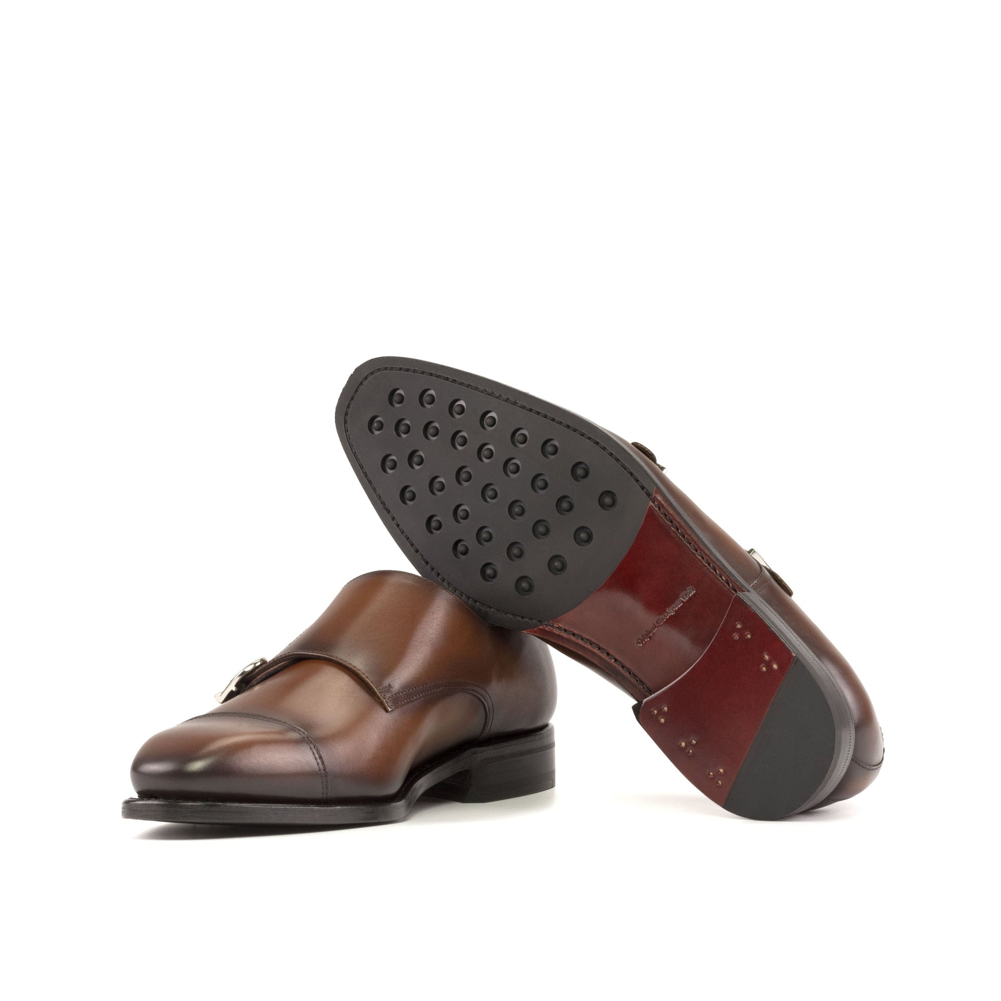 Double Monk Strap in Burnished Burgundy Painted Box Calf and Burnished Burgundy Box Calf showing dark red leather sole with rubber dot injections