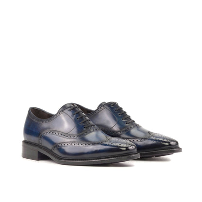 Wingtip Oxford in Denim Patina Box Calf, front three-quarter view