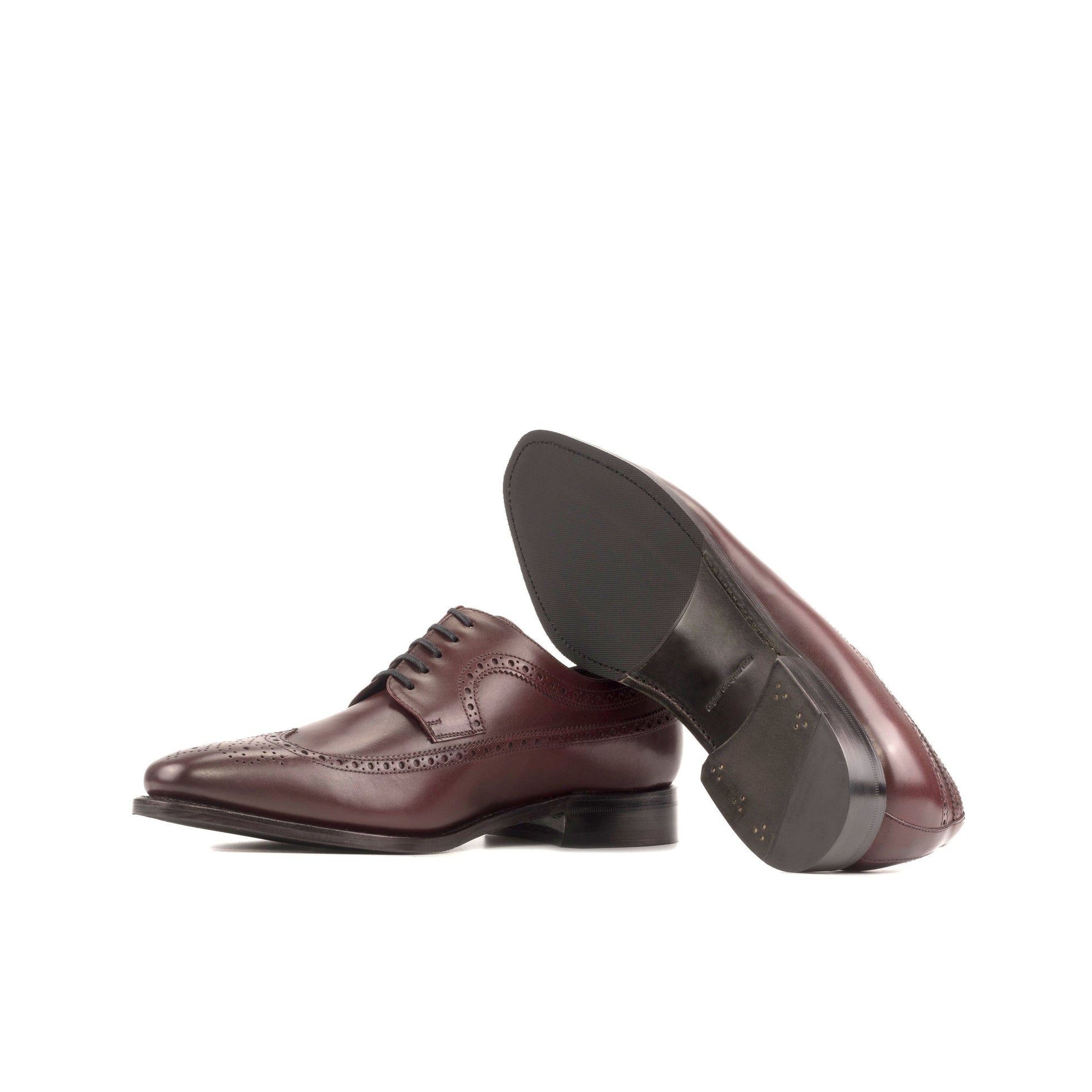 Long Wingtip Derby in Burgundy Box Calf showing forest green leather sole
