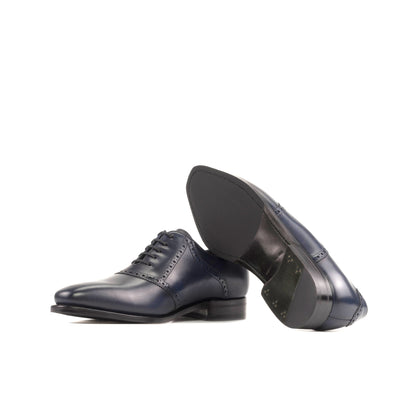 Saddle Shoe in Navy Box Calf showing forest green leather sole